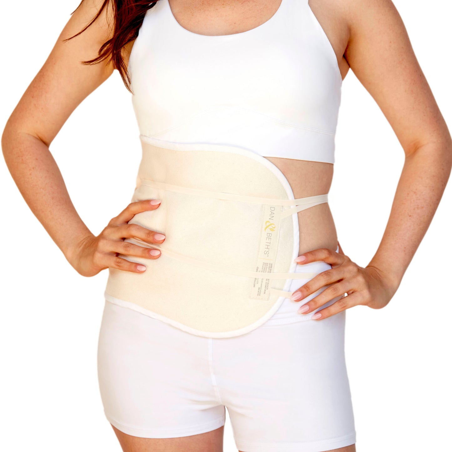 Woman wearing castor oil pack on waist